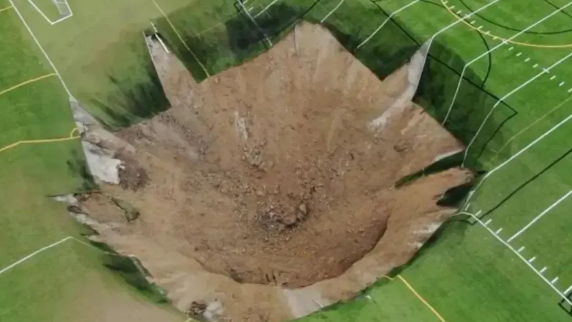 portal plural um campo de futebol em alton, illinois, eua, foi devastado por uma cratera que se abriu no meio do gramado. o incidente foi capturado pelas câmeras de segurança da área.
